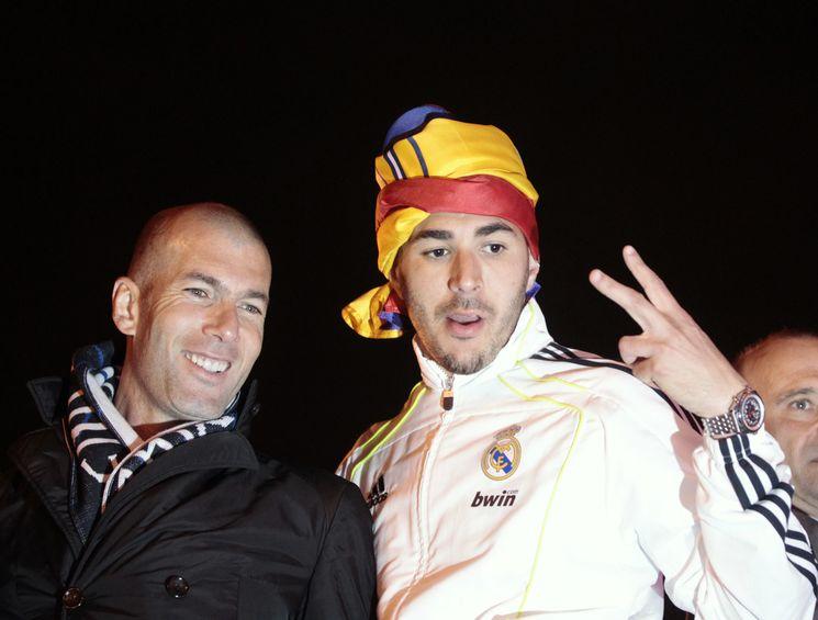 Real Madrid team advisor Zidane and player Benzema celebrate winning the King's Cup, at Cibeles fountain in Madrid