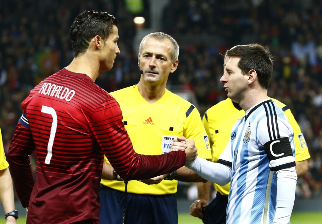 Football - Argentina v Portugal - International Friendly - Old Trafford, Manchester, England - 18/11/14 Portugal's Cristiano Ronaldo (L) and Argentina's Lionel Messi shake hands before the match Mandatory Credit: Action Images / Jason Cairnduff Livepic EDITORIAL USE ONLY.