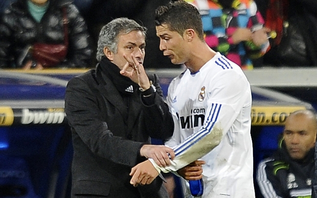 Real Madrid's Portuguese coach Jose Mour...Real Madrid's Portuguese coach Jose Mourinho (L) gives instructions to Real Madrid's Portuguese forward Cristiano Ronaldo (R) during the Spanish league football match Real Madrid CF vs Villarreal CF on January 9, 2011 at Santiago Bernabeu stadium in Madrid. Real Madrid won 4-2. AFP PHOTO/ PEDRO ARMESTRE (Photo credit should read PEDRO ARMESTRE/AFP/Getty Images)