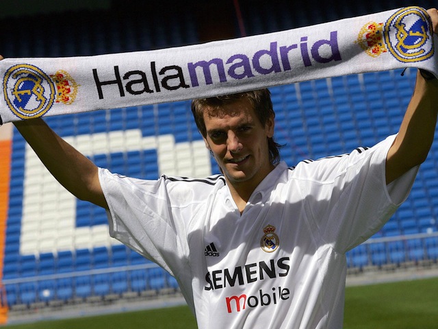 MADRID, SPAIN: Real Madrid's new British player Jonathan Woodgate poses with the club's scarf during his presentation at Santa Bernabeu Stadiun in Madrid, 21 August 2004. England international defender Jonathan Woodgate, Real Madrid's new recruit from Newcastle, will be out of action for a month but that did not deter the Spanish giants from signing him, British media reported 21 August. AFP PHOTO / PEDRO ARMESTRE (Photo credit should read PEDRO ARMESTRE/AFP/Getty Images)