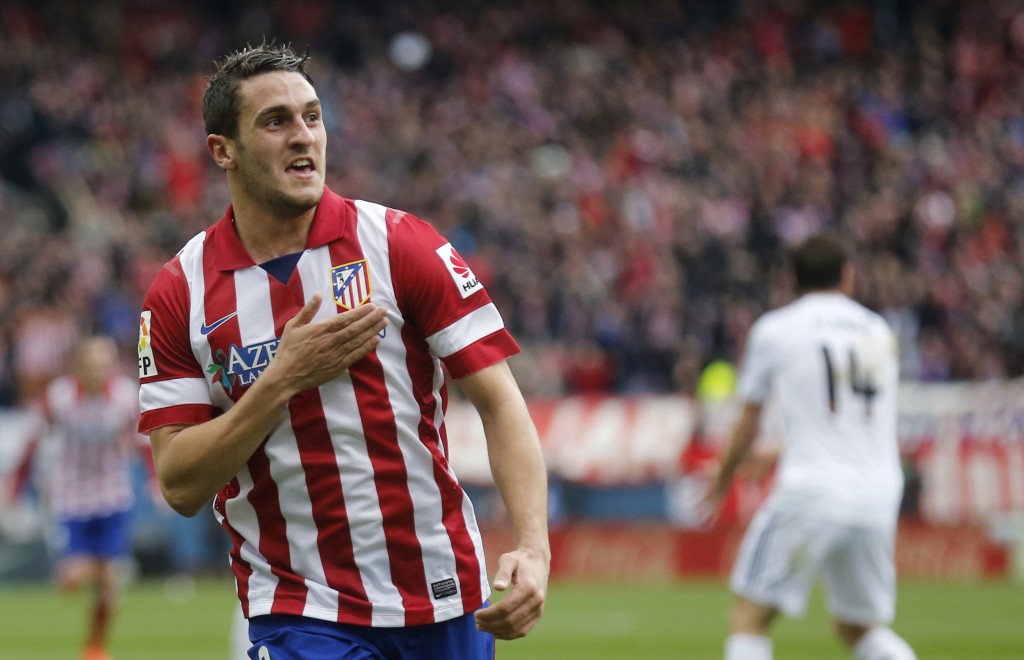REFILE - WITH ADDITIONAL INFORMATION Atletico Madrid's Jorge "Koke" Resurrecion celebrates his goal against Real Madrid during their Spanish first division soccer match at Vicente Calderon stadium in Madrid March 2, 2014. REUTERS/Andrea Comas (SPAIN - Tags: SPORT SOCCER)